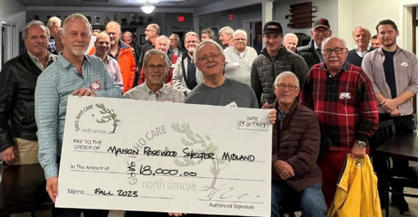 Guys Who Care Cheque to the Maison Rosewood Shelter at the meeting.