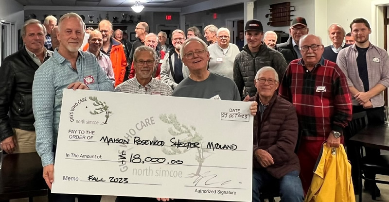 Guys Who Care Cheque to La Maison Rosewood Shelter at the meeting