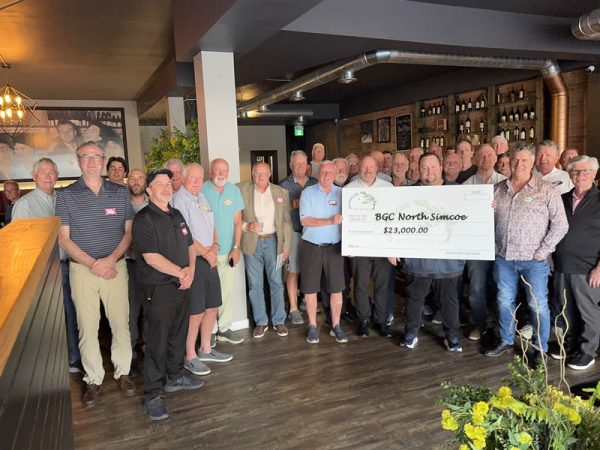 Guys Who Care group holding the cheque for BGC North Simcoe
